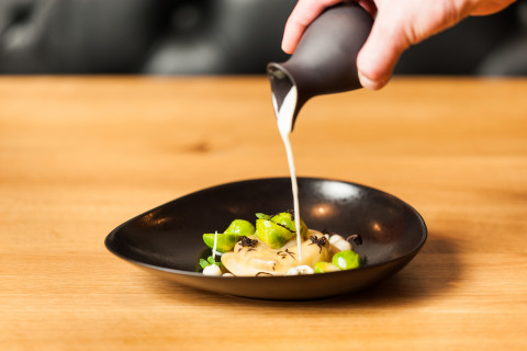 Ravioli with duck confit and foie gras, topinambour velouté with black truffle